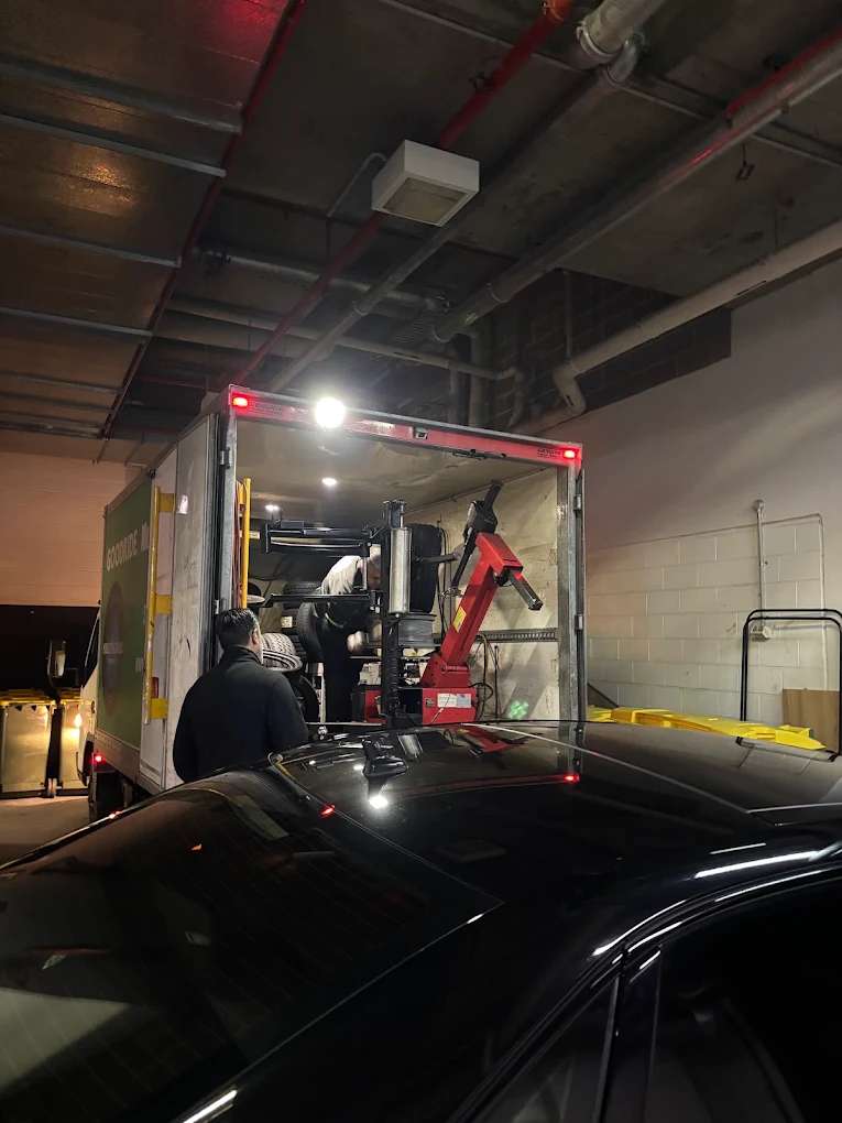 A Mobile Tyre World truck with its tyre machine running in an underground car park